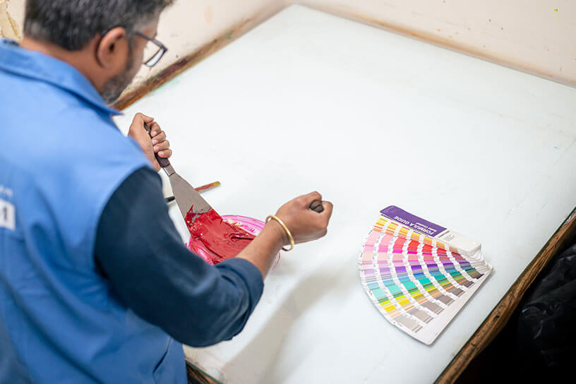 A man is making a new color for catalog printing